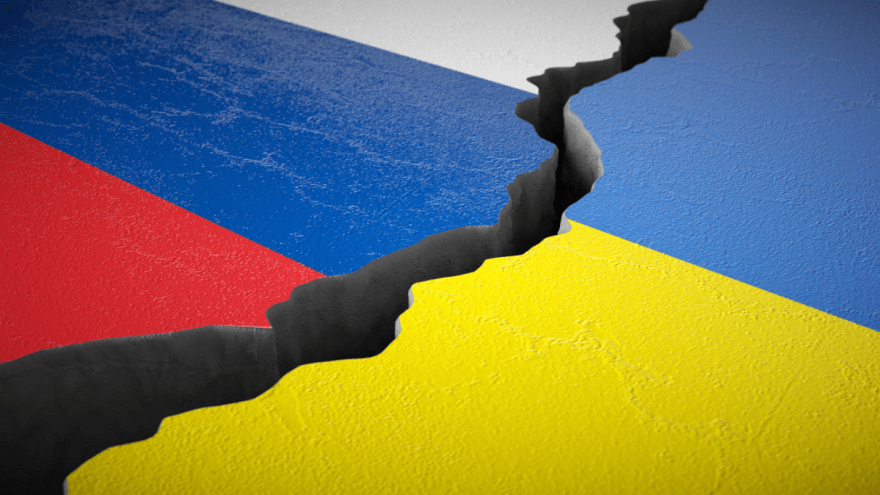 Zwischen zwei Landmassen in den Farben der Ukraine bzw. Russlands ist ein Riss.