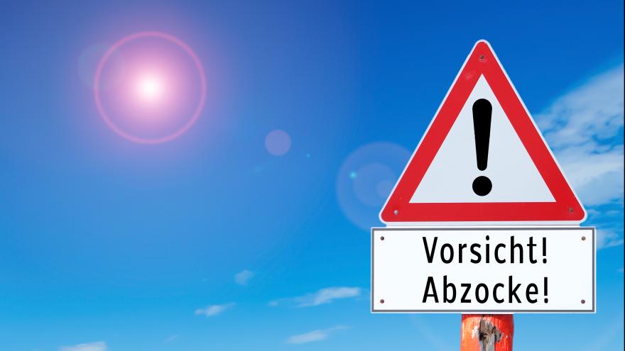 Schmuckbild: Verkehrsschild, auf dem "Vorsicht Abzocke!" steht